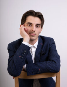 Teenage actor male with hand on face