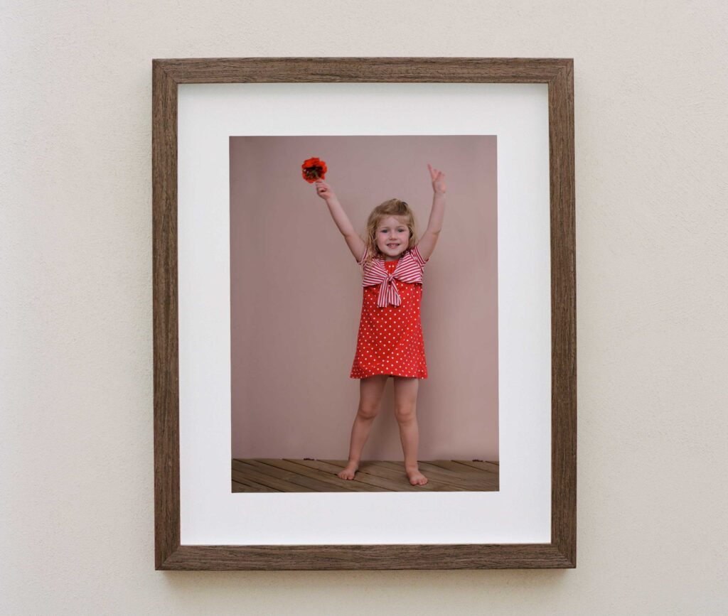 Photo frame of girl holding flowers